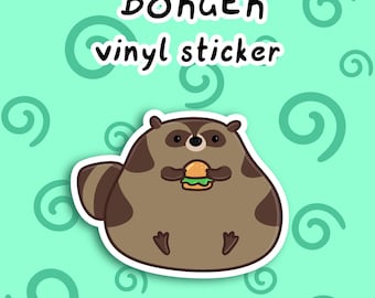 Puede incluir: Una pegatina de vinilo con un mapache marrón y redondo que sostiene una pequeña hamburguesa. El texto BORGER vinyl sticker está impreso sobre el mapache en letras negras con borde blanco. El fondo es verde menta claro con espirales.