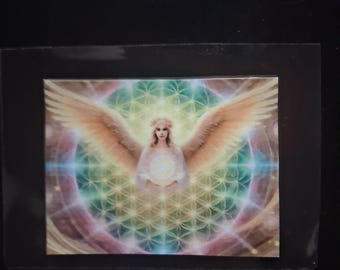 May include: A rectangular card featuring a central illustration of a winged figure with long hair and a floral crown. The figure holds a glowing orb against a background of a geometric flower of life pattern in shades of green, blue, and pink.