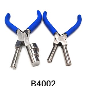May include: Two metal pliers with blue rubber handles are displayed against a white background. The pliers have a silver finish and are designed for a specific mechanical task. The text "B4002" is printed in black.
