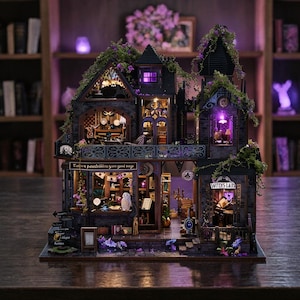 May include: A detailed miniature witch's house with multiple stories, featuring intricate architectural details and interior lighting. The facade is dark gray with green vines and purple flowers. The shop sign reads "Witch's Lair". The house is filled with miniature furniture and decor.