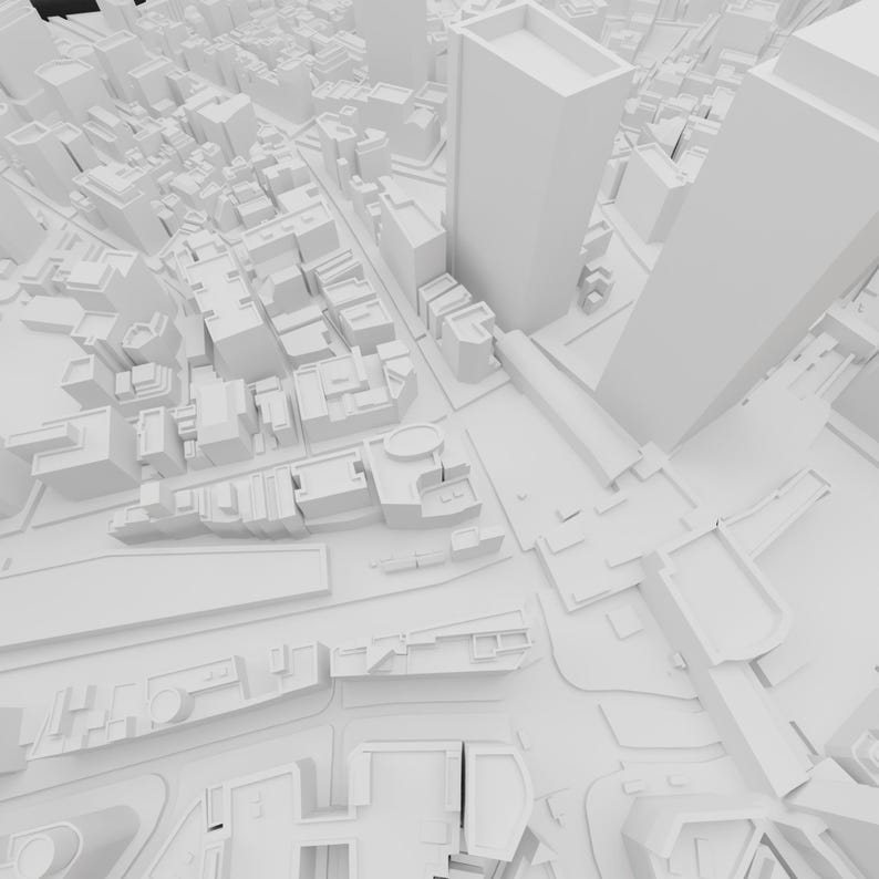 May include: A white 3D model of a city with tall buildings and streets. The model is rendered in a simple, minimalist style, with no colour or texture.