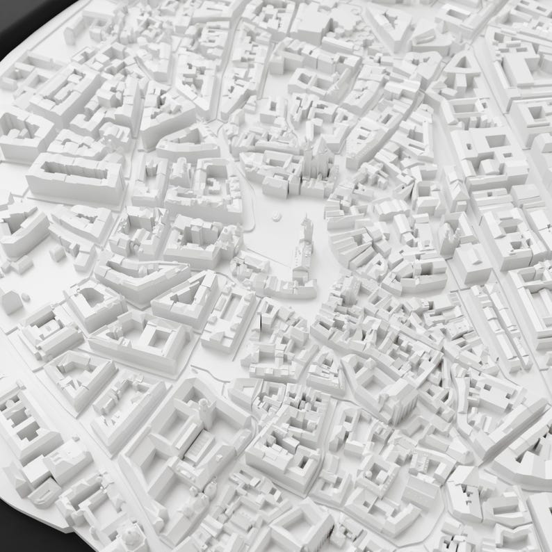 May include: A detailed, white 3D model of a city, showcasing buildings, streets, and urban planning. The model is a monochromatic representation of an urban landscape, with a high level of detail in the architectural structures.