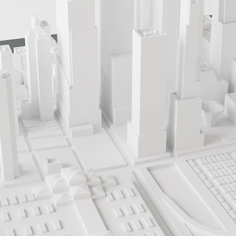 May include: A white, 3D model of a city skyline with tall buildings and a street grid.