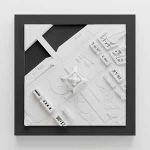 K&ouml;nnte beinhalten: Ein wei&szlig;es 3D-Modell einer Stadt mit einem hohen Geb&auml;ude in der Mitte. Das Modell ist in einem schwarzen Rahmen gerahmt.