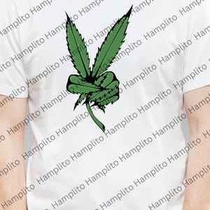 May include: A white t-shirt with a green marijuana leaf design in the shape of a peace sign.