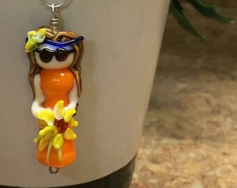 Handmade lampwork glass pendant charm. Too cool. 1960's flower child hippy chick, Susan. Orange dress with sunflower.