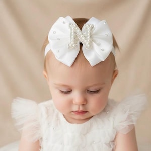 Gepersonaliseerde babyhoofdband: strik met parel en strassteentjes