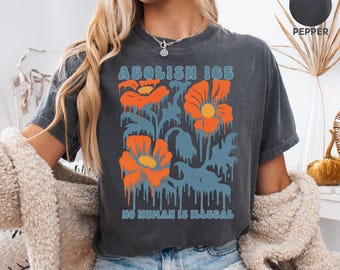 Floral Abolish ICE Human is Illegal Comfort Colors® Shirt, Political Resistance Shirt, Anti-Trump Activist Wear, No Human is Illegal Tee