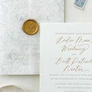 May include: Wedding invitation with a white background and gold lettering. The invitation reads "Together with their families, Leslie Moon Wankerwicz and Brett Patrick Nantan request the pleasure of your company at the celebration of their marriage, Saturday, the sixth of August, two thousand twenty-two at five o'clock, Mission Point Resort, Mackinac Island, Michigan. Reception to follow."