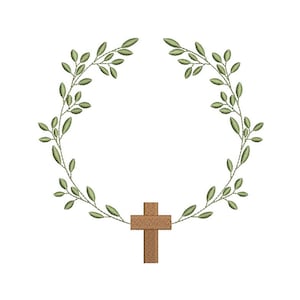 Może przedstawiać: Haftowany wzór z brązowym krzyżem na dole, otoczonym wieńcem z zielonych liści. Liście są szczegółowo wykończone jasnymi zielonymi ściegami, tworząc delikatną, inspirowaną naturą estetykę. Projekt jest na białym tle.
