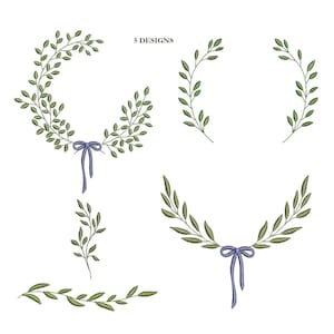 May include: Five embroidered designs featuring green leaf branches and wreaths with a blue ribbon. The designs include a full wreath, two half wreaths, a single branch, and a horizontal branch design. The text "5 DESIGNS" is at the top.