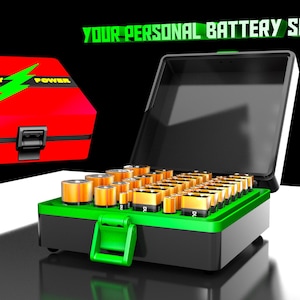 May include: A black and green storage case filled with various cylindrical and rectangular batteries. The lid is open, revealing organized slots. A separate red case with a black latch and the text BATTERY POWER with a green lightning bolt is shown.