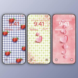 May include: Three smartphone screens displaying different wallpapers. One features red strawberries on a blue and white checkered background. Another has pink hearts on a green diamond pattern. The last shows pink hearts on a pink background. Each screen displays the time 9:41 and the date.