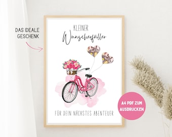 May include: A framed print featuring a pink bicycle with a basket of pink flowers. Two heart-shaped balloons float above the bike. Text includes "Kleiner Wunscherfüller" and "Für dein nächstes Abenteuer."