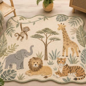 May include: A cream-colored area rug with a scalloped edge featuring a jungle theme. The rug displays a brown monkey hanging from a vine, a tall giraffe, a gray elephant, a golden lion, and a striped tiger surrounded by green palm leaves.