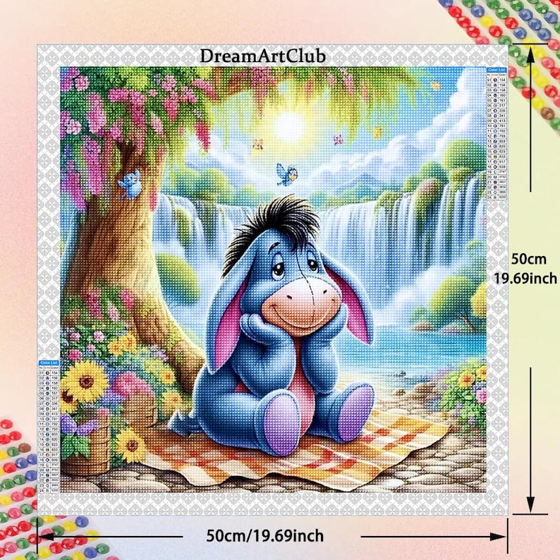 May include: A blue cartoon donkey with a pink nose and big eyes sits on a picnic blanket in a whimsical landscape with a waterfall and flowers. The scene is surrounded by a white border with the text "DreamArtClub" and measurements in inches and centimeters.