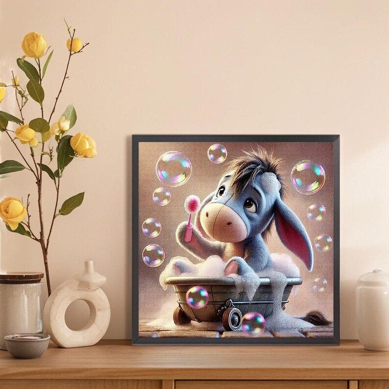 May include: A blue cartoon donkey sits in a white bathtub with pink soap bubbles floating around it. The donkey is holding a pink wand and blowing bubbles. The background is a light brown color with more bubbles.