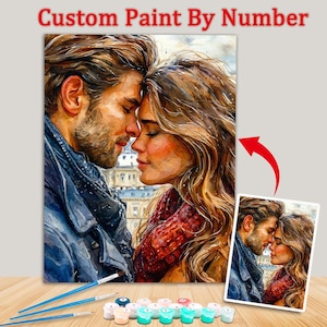 Könnte beinhalten: Ein individuelles Malen-nach-Zahlen-Set mit einem romantischen Aquarellgemälde eines Paares. Das Kunstwerk zeigt einen Mann und eine Frau, deren Stirn sich berührt. Das Set enthält Pinsel, nummerierte Farbtöpfe und ein Referenzbild.