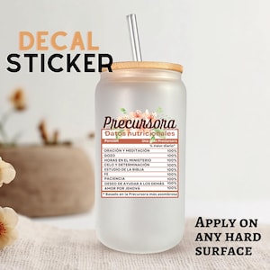May include: A frosted glass tumbler with a bamboo lid and a stainless steel straw. The tumbler has a decal with the word "Precursora" and a nutritional facts label in Spanish. Text on the image says "Decal Sticker" and "Apply on any hard surface."