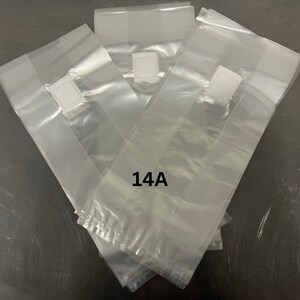 May include: Several clear plastic bags with white closures. The bags are rectangular and sealed at the bottom. The text "14A" is printed on the bags.