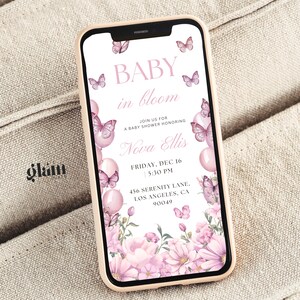 May include: A pink and white baby shower invitation with butterflies and flowers. The text reads "Baby in Bloom" and includes the date, time, and location of the event.  Join us for a baby shower honoring Nova Ellis. Friday, Dec 16, 5:30 PM, 456 Serenity Lane, Los Angeles, CA 90049.