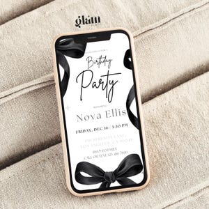 May include: A black and white birthday party invitation with a black ribbon bow. The invitation reads "Please join us for a Birthday Party honouring Nova Ellis, Friday, Dec 16, 5:30 PM, 456 Serenity Lane, Los Angeles, CA 90049, RSVP to Emily, Call or Text: 123-456-7890".
