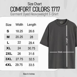 May include: A dark gray Comfort Colors 1717 Garment Dyed Heavyweight T-Shirt with a size chart. The chart shows sizes S-4XL with width and length measurements in inches. The shirt has a crew neck and short sleeves.