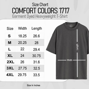 May include: Size chart for a garment dyed heavyweight t-shirt in sizes S through 4XL. The chart shows the width and length measurements in inches for each size.
