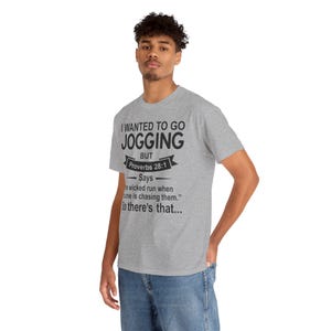Christian Humor T-Shirt — “I Wanted to Go Jogging But Proverbs 28:1” Funny Faith Tee - Funny Bible Quote T Shirt - Christian Humor Tee