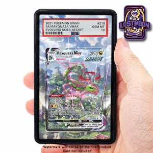 May include: A Rayquaza VMAX Pokémon card, graded GEM MT 10, encased in a black holder. The card features a green and pink dragon illustration with the text "Rayquaza VMAX" and "Rapid Strike". The card is from the Evolving Skies set.