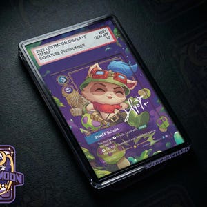 May include: A rectangular trading card encased in a clear protective slab featuring a cartoon character with blue hair and goggles. The card text reads 2026 LOSTMOON DISPLAYS TEEMO SIGNATURE OVERNUMBER #001 GEM MT 10 and Swift Scout with game instructions.