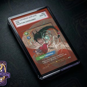 May include: A rectangular trading card encased in a clear protective slab. The card features an illustration of a character with dark hair and fox ears, labeled Ahri Nine-Tailed Fox. Text includes 2026 LOSTMOON DISPLAYS, #001 GEM MT 10, and game mechanics.