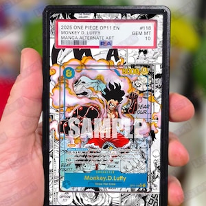 May include: A collectible trading card featuring Monkey D. Luffy from One Piece. The card has a colorful manga-style illustration with the text "SAMPLE" across the front. The card is graded and encased in a protective holder.
