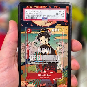 May include: A graded trading card featuring Nico Robin from the 2024 One Piece English 1st Anniversary set. The card has a colorful illustration of Nico Robin with Japanese-inspired art. The card is graded GEM MT 10.