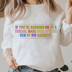 If you&#39;re hanging on by a thread, make sure it&#39;s the hem of his garment Sweatshirt, Bible verse sweatshirt, Christian sweatshirt, faith gift