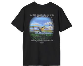May include: Black t-shirt featuring a colorful graphic of a yellow biplane spraying a field. The graphic includes text that reads "The fields remember the roar of the RADIAL ENGINE" and "and the pilot who FIGHT with the WIND."