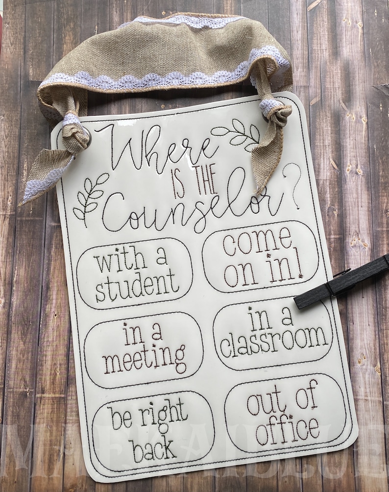 May include: White sign with black text that reads "Where is the Counselor?" with four options: "with a student", "come on in", "in a meeting", "in a classroom", "be right back", "out of office".