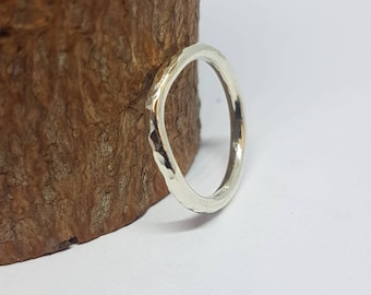 Recycled, 9 ct white gold, hammered, curved wedding ring. 2 mm wide ethical jewellery
