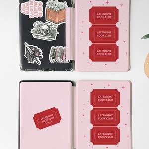 vintage and vibrant Kindle case featuring a soft pink background with three bold red ticket-style designs labeled “LATENIGHT BOOK CLUB” and marked “SINGLE USE.” Decorative pink hearts and sparkles add a whimsical, cozy vibe—perfect for book lovers who enjoy getting lost in stories after dark.