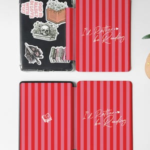 Red and pink striped Kindle case with handwritten-style script that reads “I’d Rather be Reading,” accented by two tiny hearts — a sweet and sassy nod to every book lover’s true priorities. A heartfelt gift for the friend who always sneaks a novel into their bag, your favorite coworker who reads on their lunch break, or anyone who’d rather be curled up with a good story than doing literally anything else. Perfect for Valentine’s Day, Galentine’s Day, or just because they deserve a little joy.