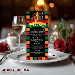 May include: A Juneteenth Celebration menu card with a black background and colorful accents. The menu features appetizers, main courses, desserts, and drinks. The top of the menu displays raised fists in red, black, green, and yellow. The menu is on a white plate with a glass of wine.