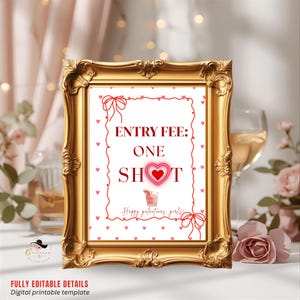 May include: A gold framed sign with the text "ENTRY FEE: ONE SHOT" in red. The sign is decorated with red hearts and bows. The bottom of the sign reads "Happy galentines, girls!" and "FULLY EDITABLE DETAILS Digital printable template".
