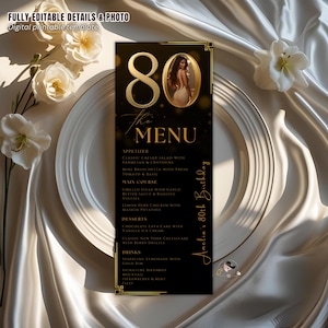 May include: A black and gold menu for an 80th birthday celebration. The menu features a photo of a woman, the number 80 in gold, and the words "The Menu". The menu includes appetizers, main courses, desserts, and drinks.