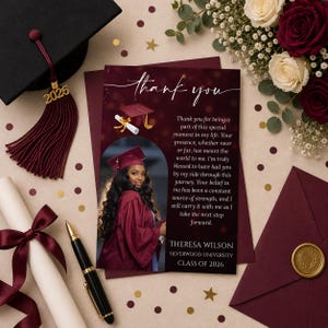 May include: A graduation-themed card with a photo of a graduate in a maroon cap and gown. The card reads "thank you" and includes a personalized message, a diploma, a pen, and a tassel with the year 2026.
