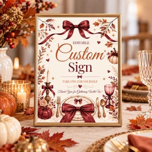 May include: A rectangular gold-framed sign featuring a cream background with burgundy ribbon accents, autumn leaves, and pumpkins. The text reads: EDITABLE Custom Sign, TAKE ONE FOR YOURSELF, and Thank You for Gathering With Us! with illustrations of cutlery.
