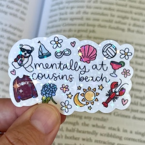 May include: A sticker featuring the phrase "mentally at cousins beach" with various small illustrations including a teddy bear, sailboat, flowers, seashell, volleyball, cocktail, and lobster.