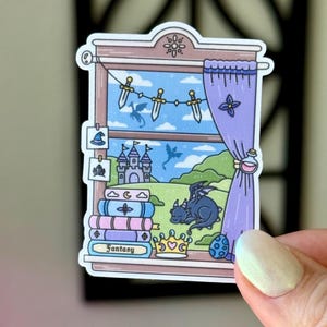 May include: A colorful sticker featuring a fantasy scene. The sticker depicts a window with a view of a castle, dragons, and swords. A stack of books with the word "Fantasy" is in the foreground. A purple curtain is drawn to the side.