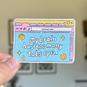 May include: A rectangular sticker featuring a computer browser window design. The sticker has a light blue background with the text "My brain has too many tabs open." The browser window has a search bar with the URL "burnout.com" and a smiley face.