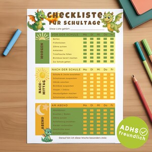 May include: A printed school day checklist with a green dragon illustration. The checklist is divided into morning, afternoon, and evening sections, with checkboxes for each day of the week. The text includes "Checkliste für Schultage".