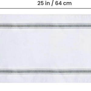 Size diagram of the white bread tea towel with gray stripes, measuring 25 inches / 64 cm wide by 15 inches / 38 cm tall.